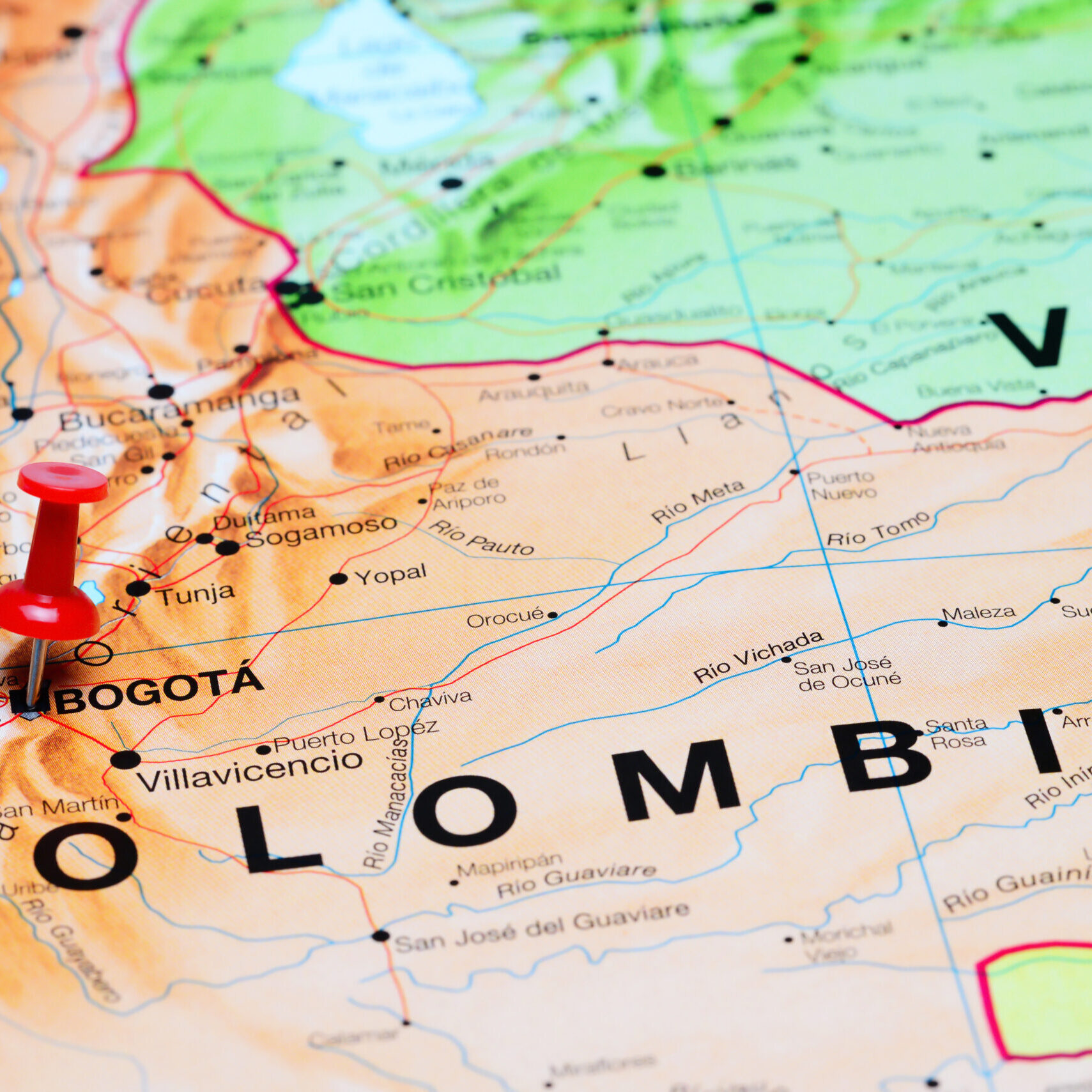 Photo of pinned Bogota on a map of South America. May be used as illustration for traveling theme.