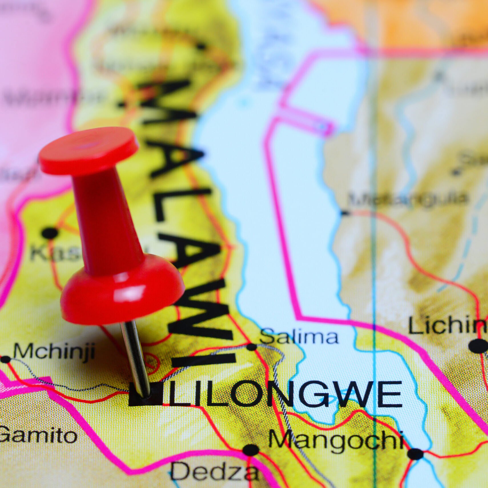 Photo of pinned Lilongwe on a map of Africa. May be used as illustration for traveling theme.